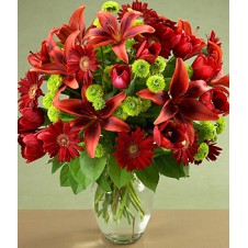 Red Lilies. Gerbera, and Tulips with Greenery in a Vase