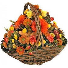 Rounded Seasonal Flower Arrangement in Wicker Basket