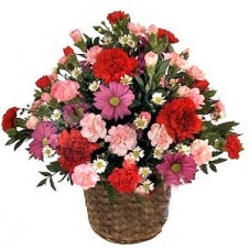 Rounded Mauve, Pink and Red Arrangement in a Wicker Basket