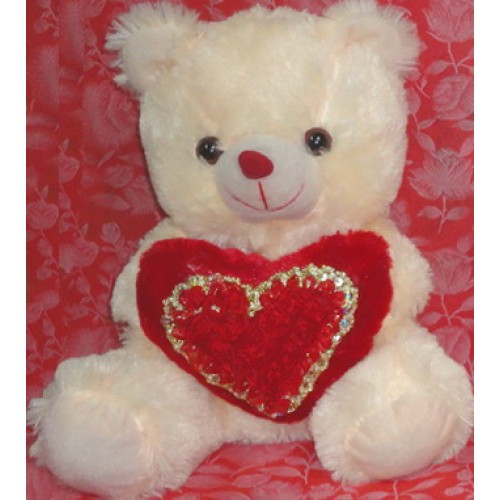 white teddy bear with red heart