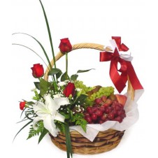 A Basket of Grapes with Flower Arrangement