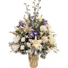 Arrangement mostly in White and more in a Bouquet