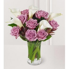 A Nice Presentation of Purple Roses with Calla lily in a Vase